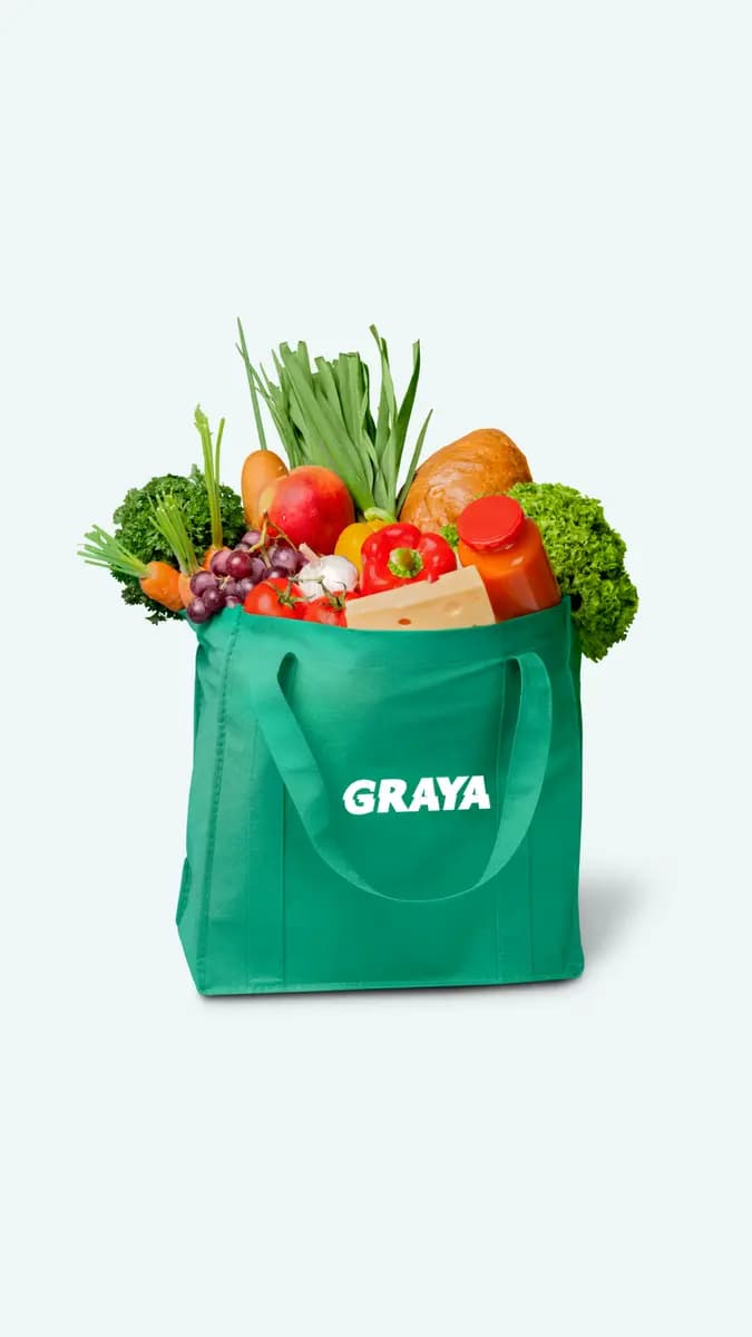 Un sac cabas vert Graya rempli de fruits et légumes frais